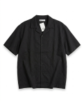 A sleek black short-sleeve shirt with subtle woven texture and a structured relaxed fit. Minimal, versatile, and elevated with quiet luxury energy.