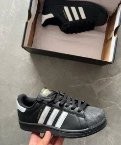 Black Adidas Superstar sneakers