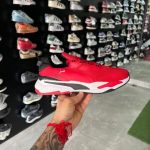 Red and white Puma Running System