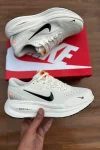 White Nike ZoomX running shoes